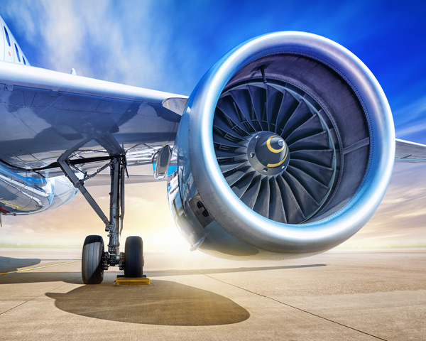 airplane jet engine close up with a blue sky background featuring advanced technology and aircraft design related to aviation innovation and efficiency in modern jet engines